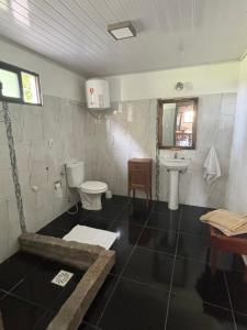 Koupelna v ubytování Casa de campo + 7 fotografií