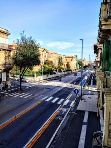 an empty street in a city with buildings at Suleima B&B Messina Centro in Messina