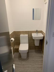 a bathroom with a toilet and a sink at Mayflower by Pureserviced in Plymouth