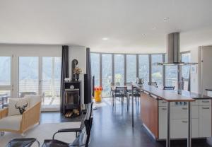 a kitchen and dining room with a table and chairs at Chalet Silence in Wengen
