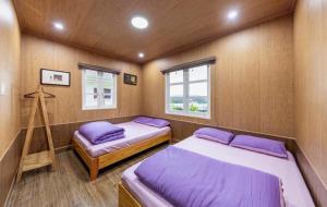 Ένα ή περισσότερα κρεβάτια σε δωμάτιο στο Bebe Homestay & Garden