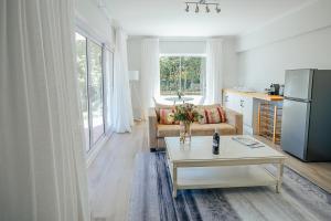 a living room with a couch and a table at On Helderberg in Somerset West