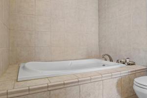 a bath tub in a bathroom with a toilet at NEW Cayuga, Hot Tub, Dog Friendly, Wine Trail in Cayuga +37 photos