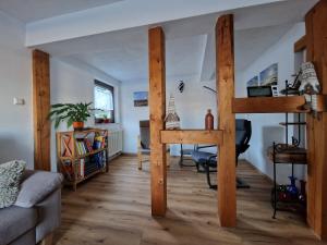 a room with a loft bed and a living room at Ferienwohnung Strohbergblick in Schichtshöhn