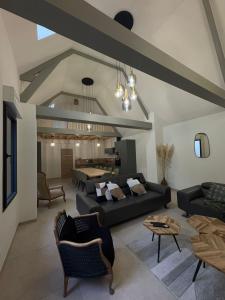 a large living room with couches and a table at Hortense in Étaples
