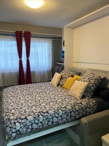 Кровать или кровати в номере Le Beaulieu