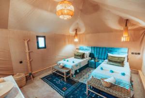 Postel nebo postele na pokoji v ubytování Kidal Camp