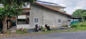 two motorcycles parked in front of a house at Fahad Calm House in Ban Not (1)