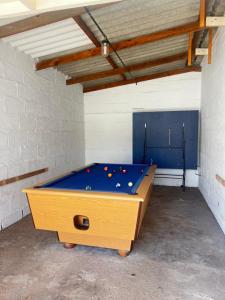 a ping pong table in a room with a pool table at The Royal Carat by kingvips in Kleinsee