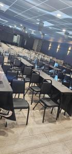 a room with tables and chairs in a library at Opal Hotel & Suites in Orlando +108 photos