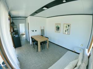 a living room with a table and a couch at Serena in Mar de las Pampas
