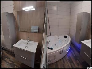 a bathroom with a tub and a sink at Grand Appartement Luxe avec SAUNA et BAIN LED 50m de l océan avec belle terrasse pour manger CHIEN ADMIS 2 chambres pour 4 pers avec GRANDE BAIGNOIRE BALNEO SPA in Biscarrosse +11 photos