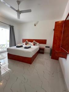Postel nebo postele na pokoji v ubytování Thoddoo Cozy Stay