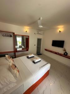 Postel nebo postele na pokoji v ubytování Thoddoo Cozy Stay