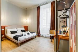 En eller flere senge i et værelse på VIVILO COLLECTION - Collina 24 Suites - close to Via Veneto