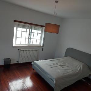 a bedroom with a bed and a window at Apartment Casa Abundancia Grande in Vila Nova de Poiares +20 photos
