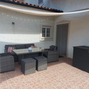 a living room with a couch and a table and chairs at Apartment Casa Abundancia Grande in Vila Nova de Poiares