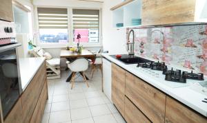 a kitchen with a sink and a counter at Nensica in Vukovar