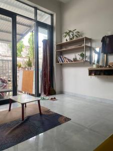a living room with a coffee table on a tile floor at Pepper In Nha Trang Homestay in Nha Trang