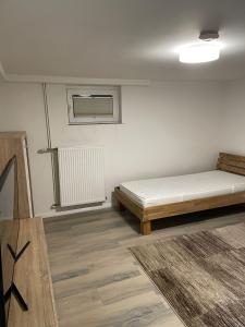 Ένα ή περισσότερα κρεβάτια σε δωμάτιο στο GB Apartments
