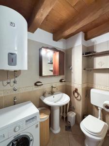 a bathroom with a sink and a toilet at City Center Coastal Escape - Apartments with Sea View or Cozy Room in Novigrad Istria +49 photos