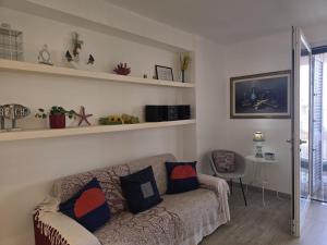 a living room with a couch and a table at Villa Meri in Torre Lapillo +33 photos