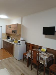 A kitchen or kitchenette at Boglárka Vendégház