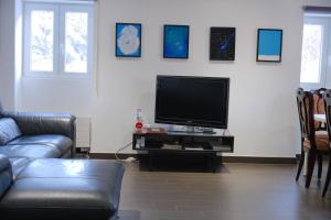 TV in/ali zabaviščno središče v nastanitvi Today Appartement Famille