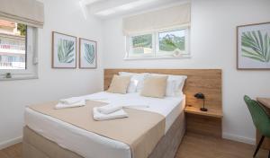 Giường trong phòng chung tại Dada Luxury Apartment A2