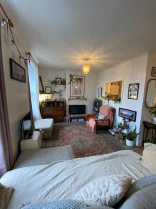 a bedroom with a bed and a living room at One-bedroom Apartment Sea Views in Rustington