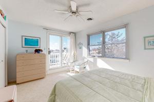 a bedroom with a bed and a ceiling fan at South Bethany --- 104 Brandywine St in Bethany Beach