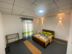 Postel nebo postele na pokoji v ubytování S and D Home Stay