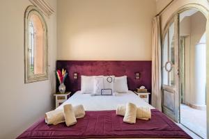 Postel nebo postele na pokoji v ubytování Riad de Charme 4 chambres à La Palmeraie + 51 fotografií