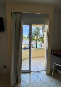 a sliding glass door with a view of a balcony at Condomínio Residencial Thermas Place Apto 119 in Caldas Novas