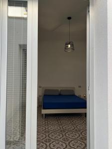 Postel nebo postele na pokoji v ubytování Global House Matino