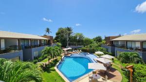 an aerial view of a resort with a swimming pool at Conforto e Paz in Imbassai