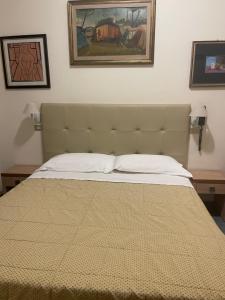 Postel nebo postele na pokoji v ubytování Hotel Ariella