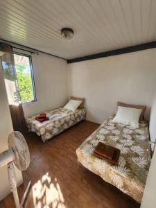 Postel nebo postele na pokoji v ubytování FARE MOEA Moorea