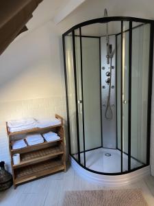 a shower with a glass enclosure in a bathroom at Loft atelier quatre in Ussel +19 photos