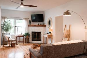 a living room with a couch and a fireplace at Bohemian Retreat in Traverse City