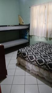 Un ou plusieurs lits dans un hébergement de l'établissement Garopaba - casa - Marcelo Américo