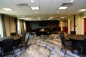 a conference room with tables and chairs on a carpet at Fairfield Inn & Suites by Marriott Denver Aurora/Parker in Aurora +43 photos