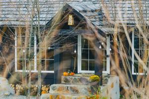 a house with pumpkins on the front porch at Luna Chalet Porumbacu - Romantic Cabin & Hot tub in Sibiu