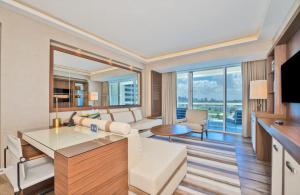 a living room with a white couch and a table at Stylish 1 BR at Fort Lauderdale in Fort Lauderdale