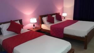 Postel nebo postele na pokoji v ubytování New Rani Inn
