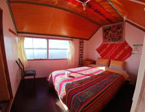 Postel nebo postele na pokoji v ubytování Uros Titicaca Khantaniwa Lodge + 33 fotografií