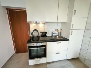 Kuchyň nebo kuchyňský kout v ubytování Apartments ZB