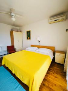 Postel nebo postele na pokoji v ubytování Apartments ZB