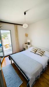 Postel nebo postele na pokoji v ubytování Apartments ZB
