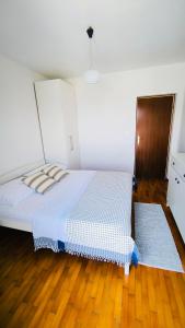 Postel nebo postele na pokoji v ubytování Apartments ZB